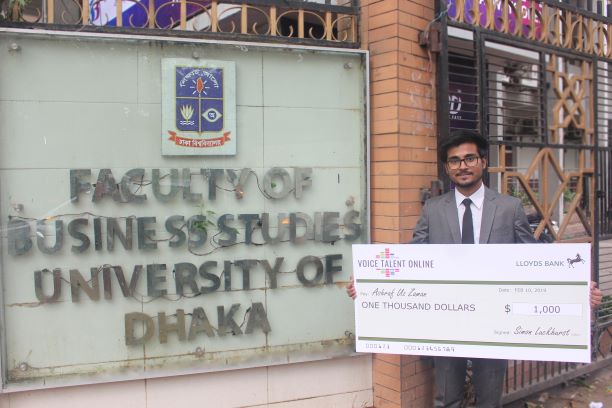 Scholarship Winner Ashraf with winner's cheque