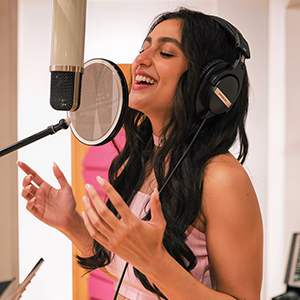 Picture of a female Telugu voice talent in the voice over booth.