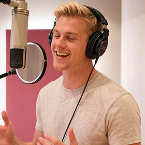 Picture of a male Swedish voice talent in the voice over booth.