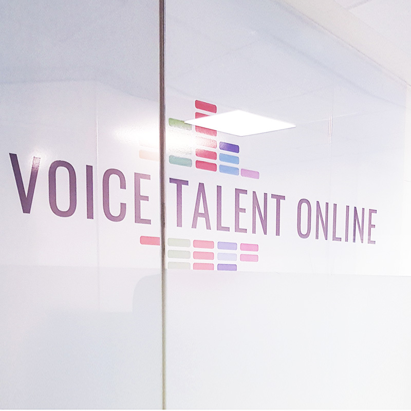 Photo of Voice Talent Online logo behind a window.